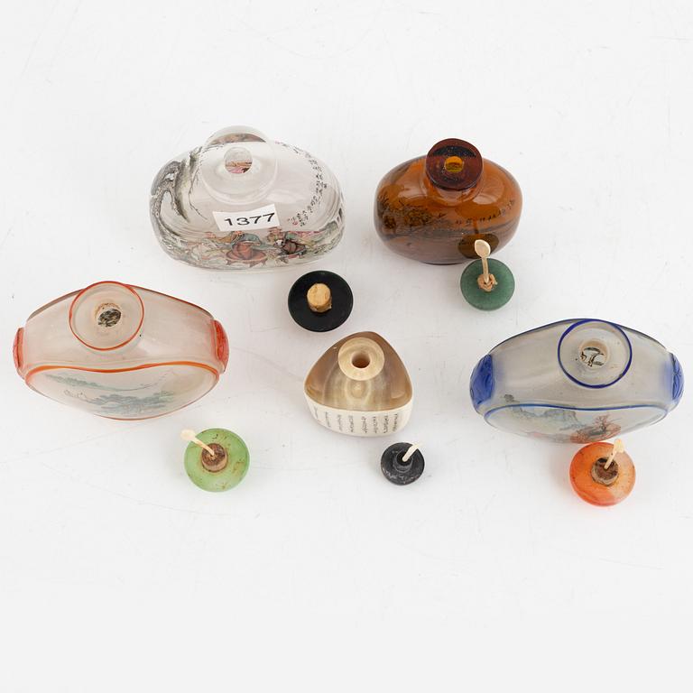 A group of five Chinese snuff bottles with stoppers, "20th Century.