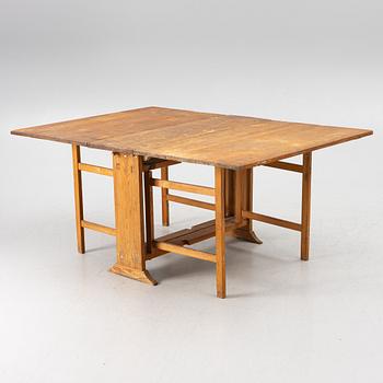 A drop-leaf table, 19th Century.