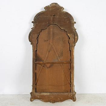A giltwood rococo mirror, Stockholm, mid 18th century.