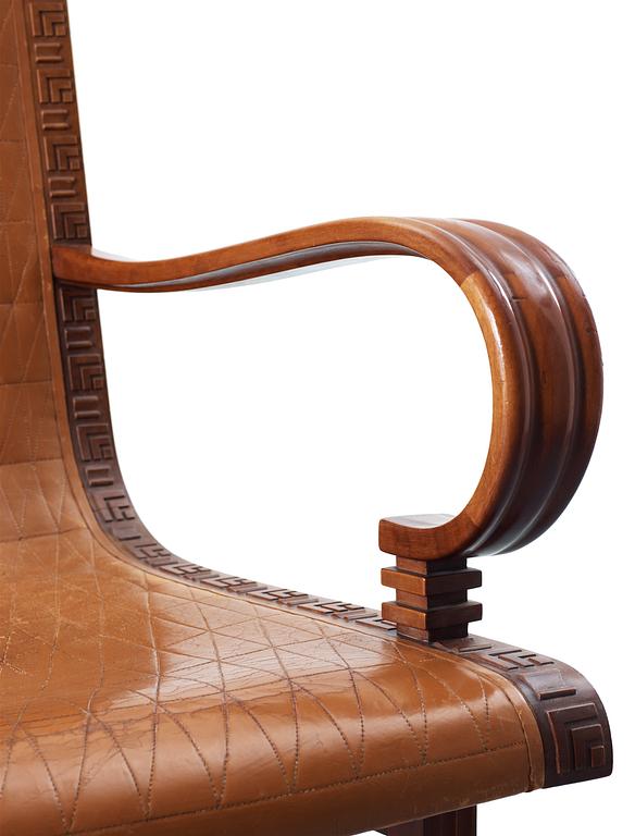 A Hjalmar Jackson pear wood and brown leather easy chair, Stockholm 1934,