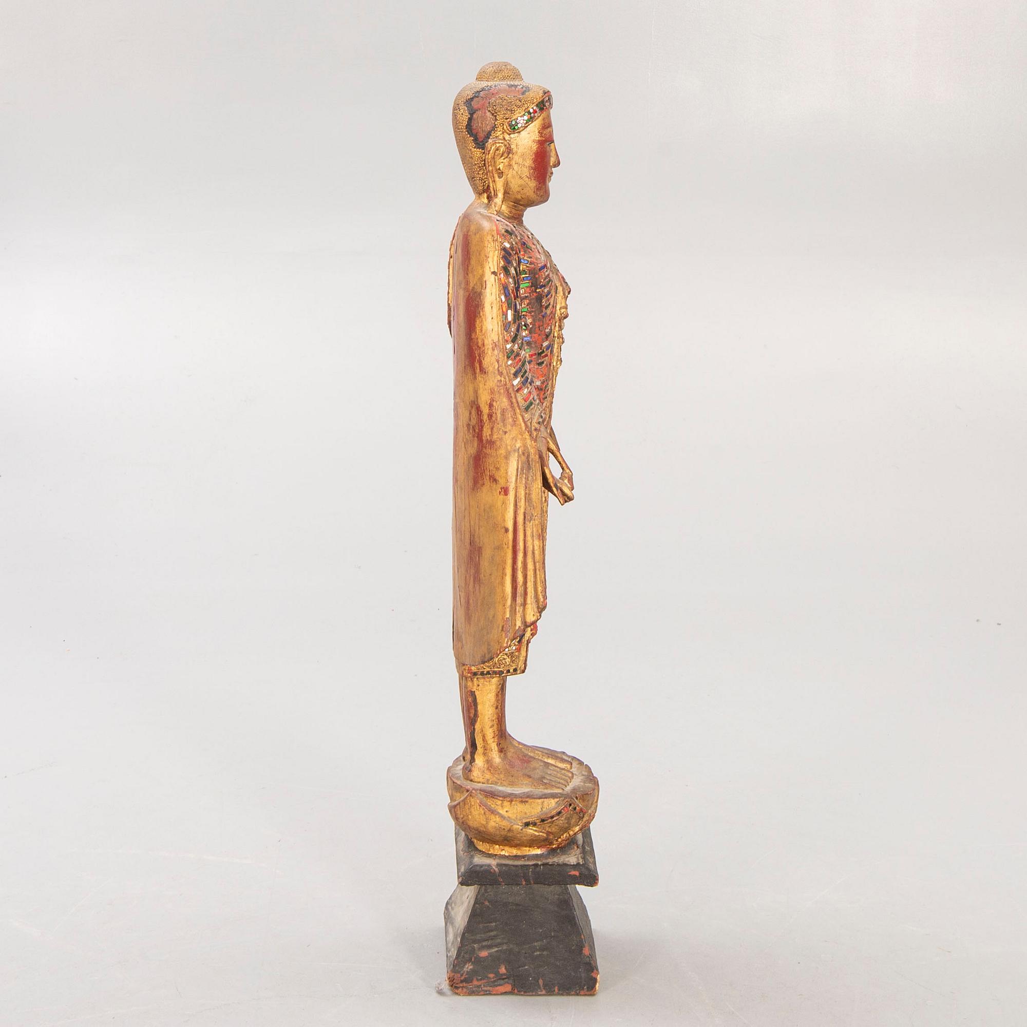 A gilde wooden Buddha first half of the 20th century.