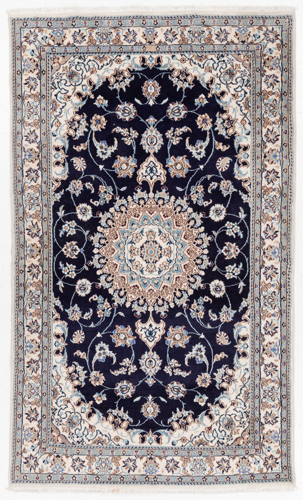 A Nain carpet, c. 255 x 150 cm.