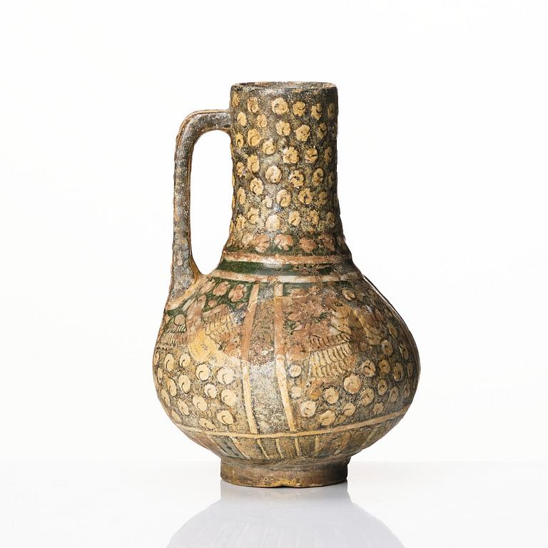 A central or northern persian pottery jug, probably 13th to 14th century.