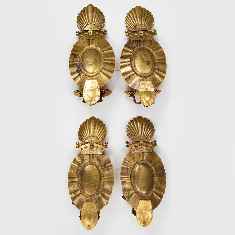 A set of four baroque style brass wall sconces, probably 1950s.