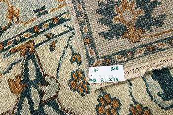An oriental carpet with Mamluk design, c. 302 x 234 cm.