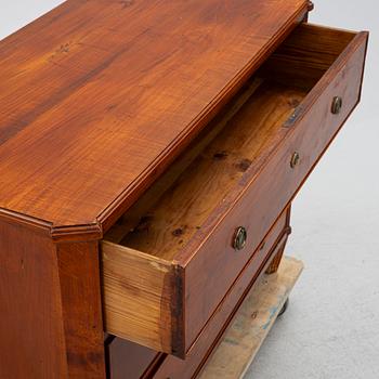 An early 19th century chest of drawers.