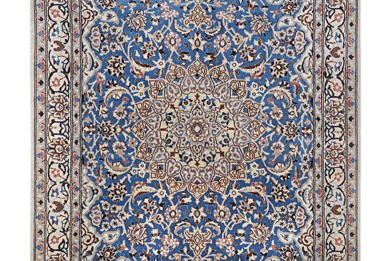 A Nain rug, part silk, 9 laa, c. 190 x 118 cm.