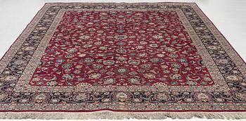 An oriental carpet, a. 378 x 278 cm.