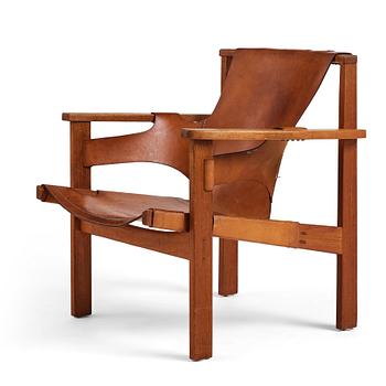 388. Carl-Axel Acking, a "Trienna" oak and natural leather easy chair, for Nordiska Kompaniet, Sweden 1960's.