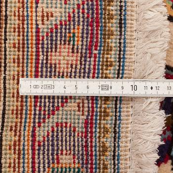 A carpet from Tabriz, around 388 x 294 cm.