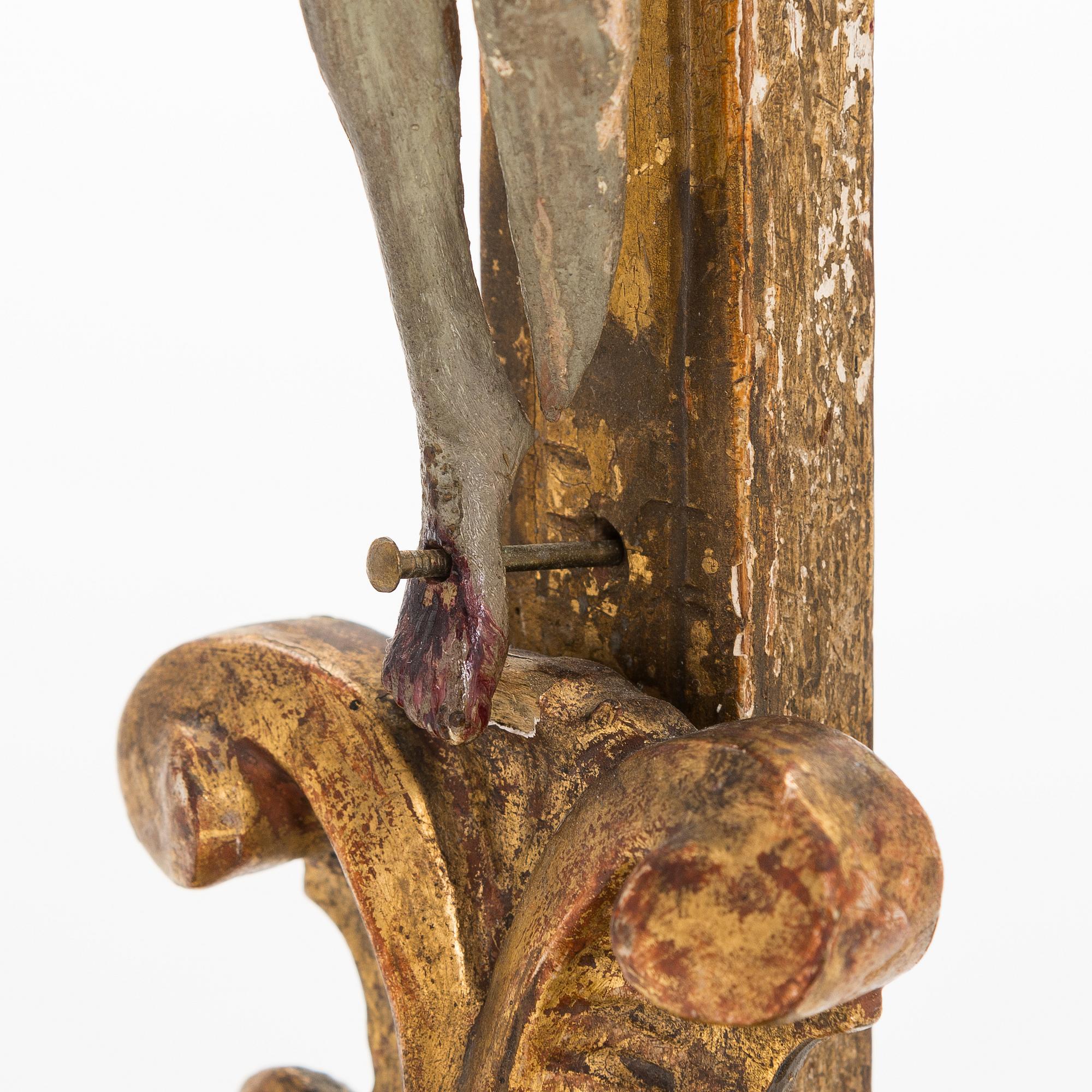 A 19th century gilded and painted wood crucifix.