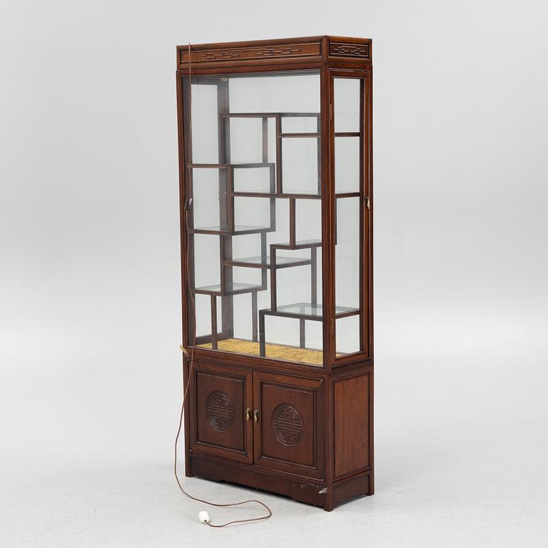 A Chinese hardwood cabinet, mid 20th century.