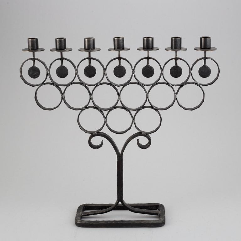A cast iron candelabra by Bertil Vallien for Kosta Smide, Sweden.