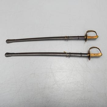 Two cavalry sabres 1867 pattern with scabbards.