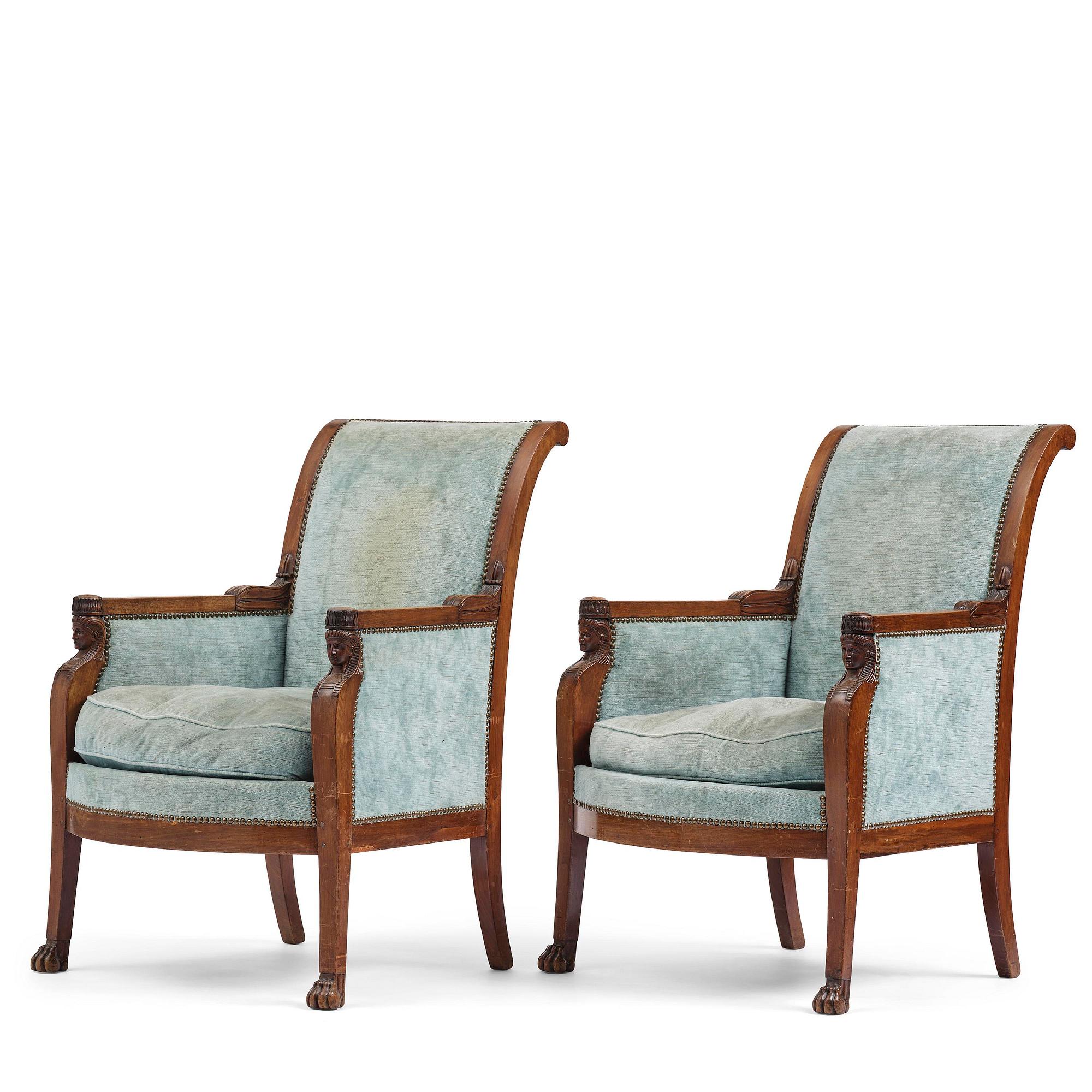 A pair of French Empire mahogny armchairs.