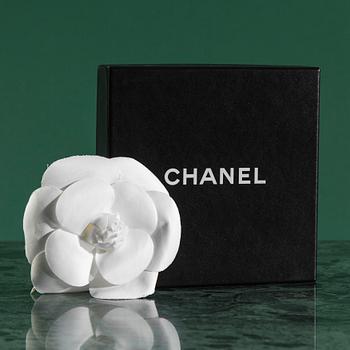 Camelia brooch by Chanel.