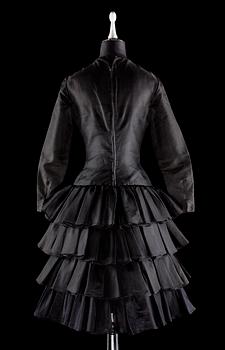 A black silk cocktail dress.