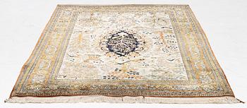 A Ghom, figural, silk rug, c. 205 x 140 cm.