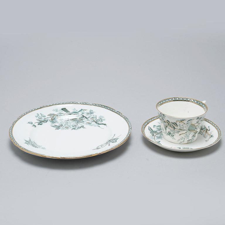 A earthenware table set of 136 pcs "Vexiö Guld",  by Arvid Ekberg, Gustafsberg, from around year 1900.
