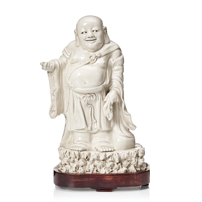 A blanc de chine figure of Buddai, Qing dynasty.