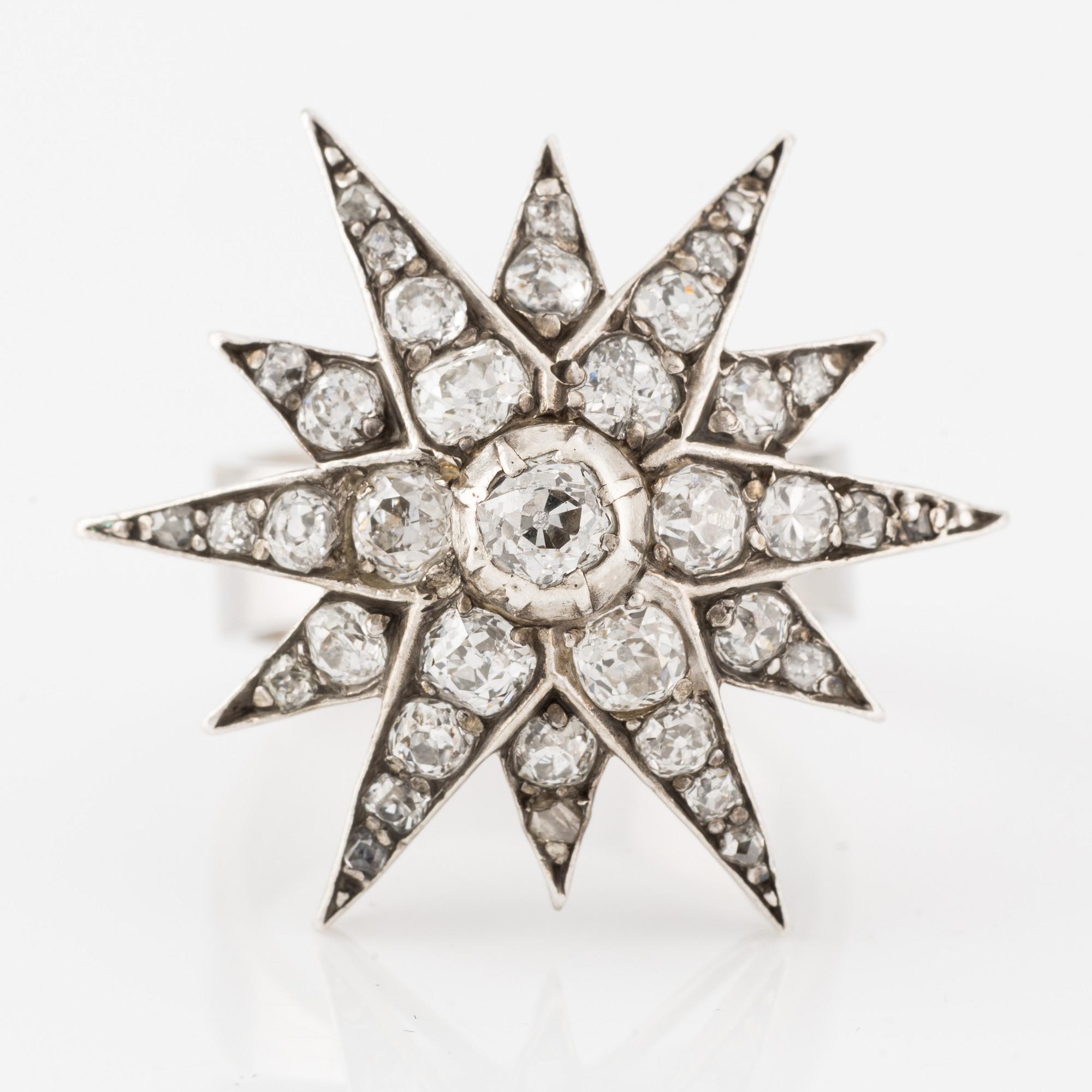 Ring, Jarl Sandin, star-shaped 18K white gold with old-cut diamonds.