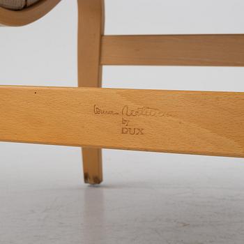 Bruno Mathsson, a pir of 'Eva' armchairs, Dux, late 20th century.
