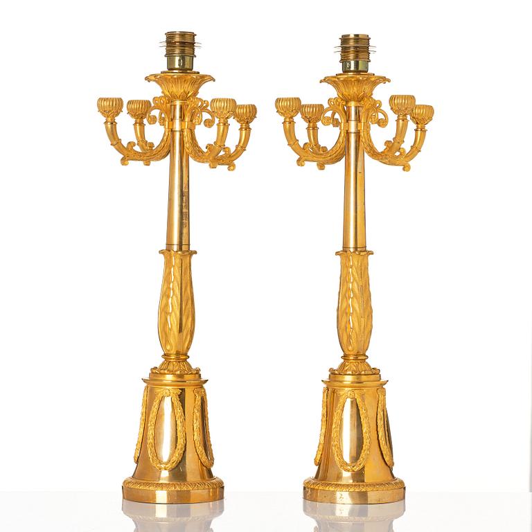 A pair of French Empire four-light candelabra (lamps), early 19th century.
