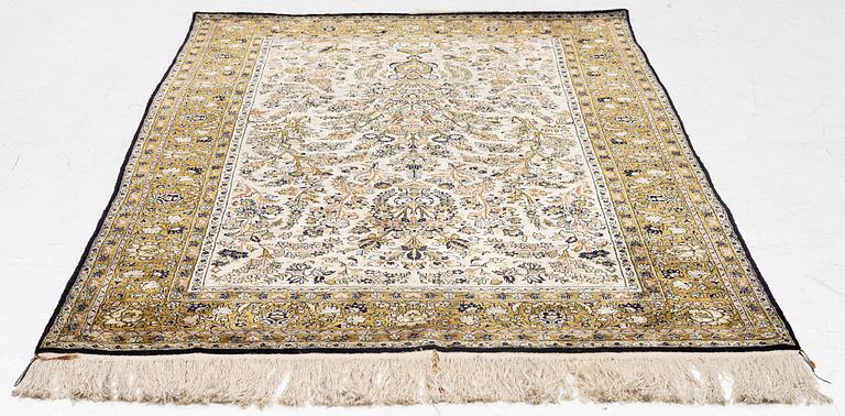 A Ghom, silk rug, c. 215 x 140 cm.