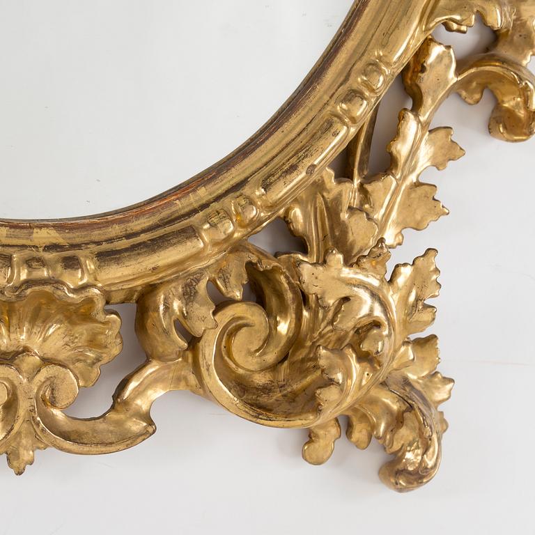 A 20th century Baroque style mirror.