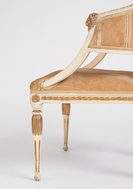 A late Gustavian carved and part-gilt open armchair, late 18th century.