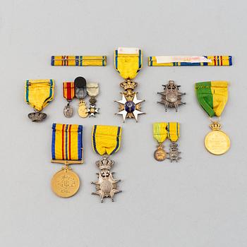 A set of medals and decorations, partly gold.