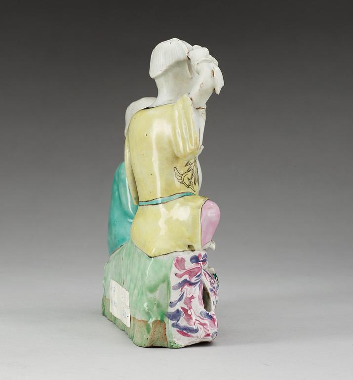 A famille rose figure of two boys, Qing dynasty, ca 1800.