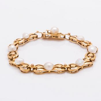 Bracelet 18k gold, cultured pearls approx 6,5 mm, 22,0 g, approx 20 x 0,8 mm.