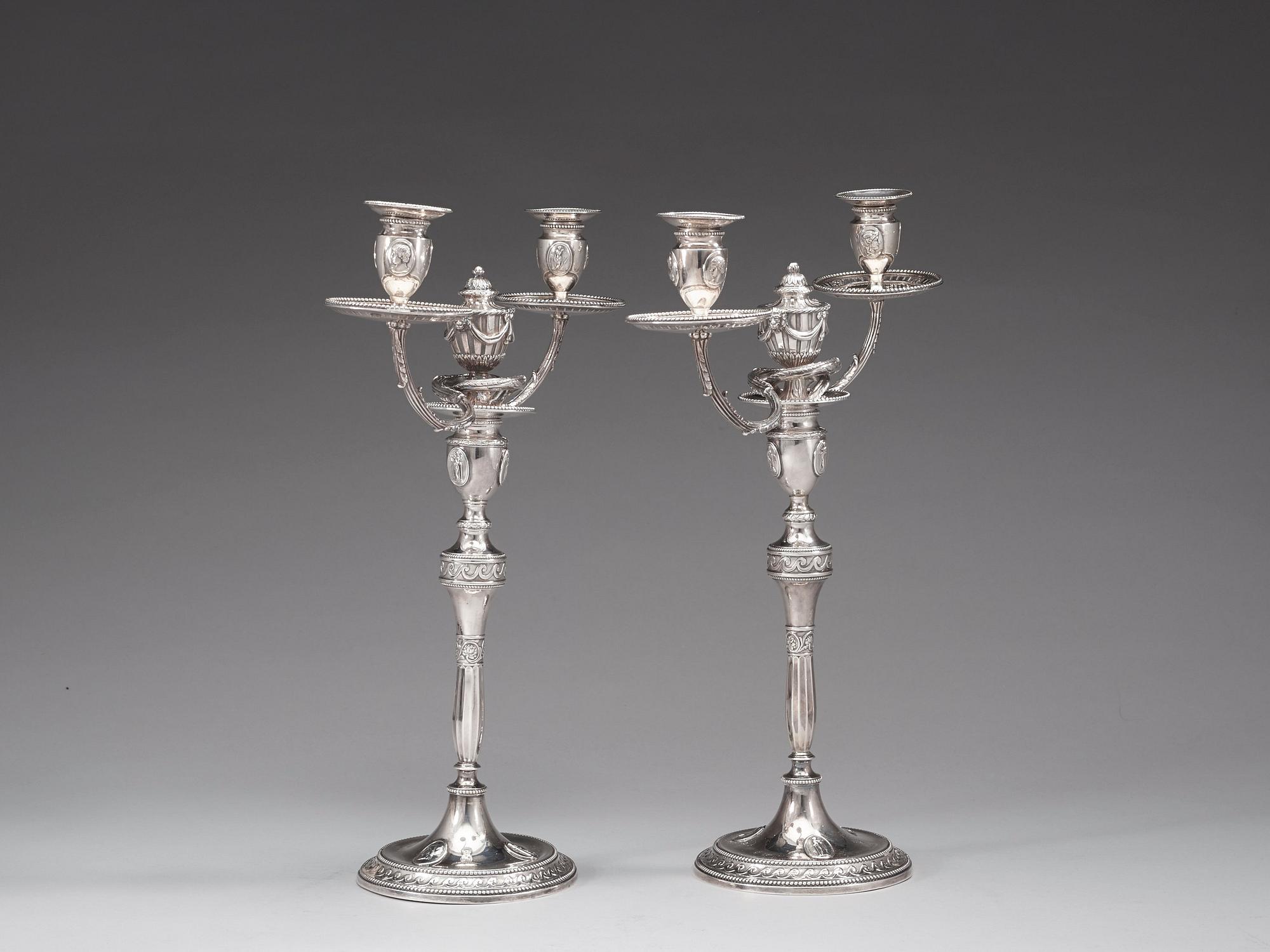 A pair of English 18th century silver candelabras, marks of Henry Hobdell, London 1778.
