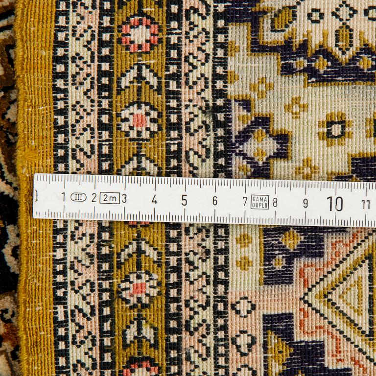 A rug, an old silk Qum, ca 158 x 104,5 cm (as well as ca 2 cm flat weave at the ends).