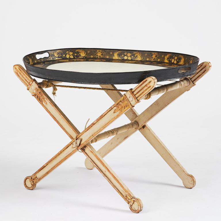A tole-peinte Empire tray, first part 19th century on a later stand.