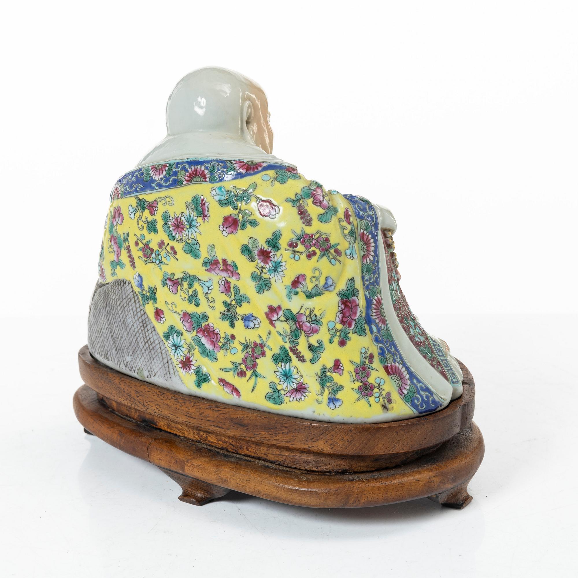 A Chinese famille rose porcelain figure of a Budai, around 1900.