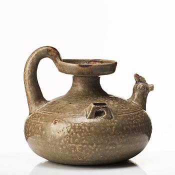 A olive green glazed wine jar, probably Jin/Six dynasties (265-420).