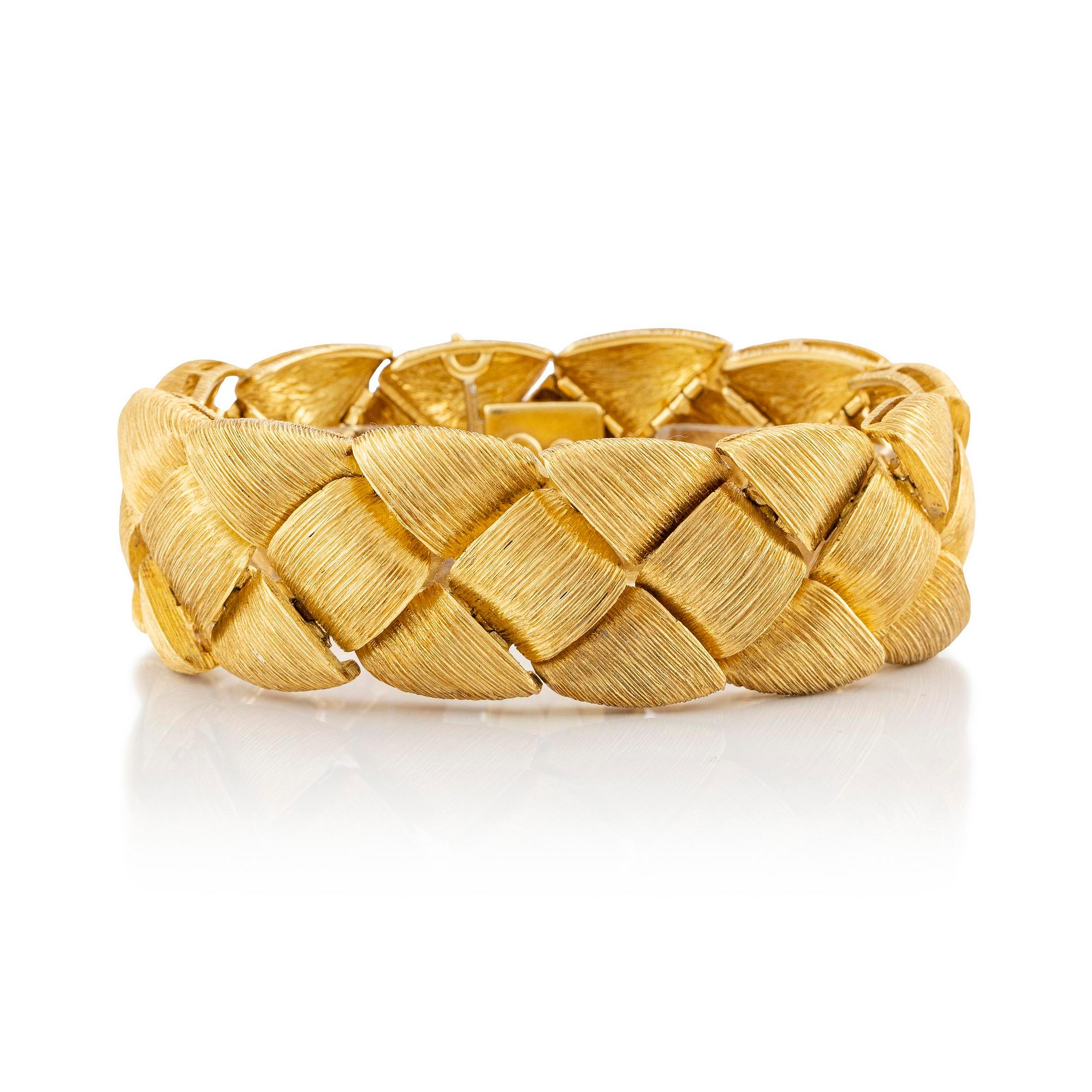 An 18K gold bracelet by Henry Dunay.