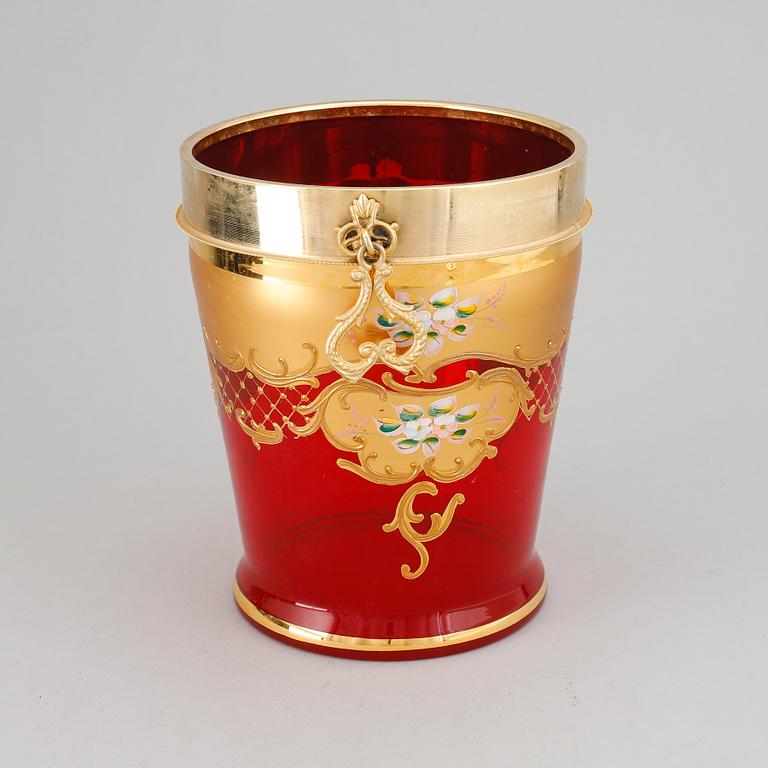 A red glass wine cooler.