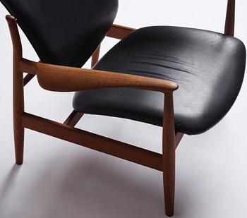 Finn Juhl, a teak and black leather 'model 136' easy chair, France & Daverkosen, Denmark 1950-60s.