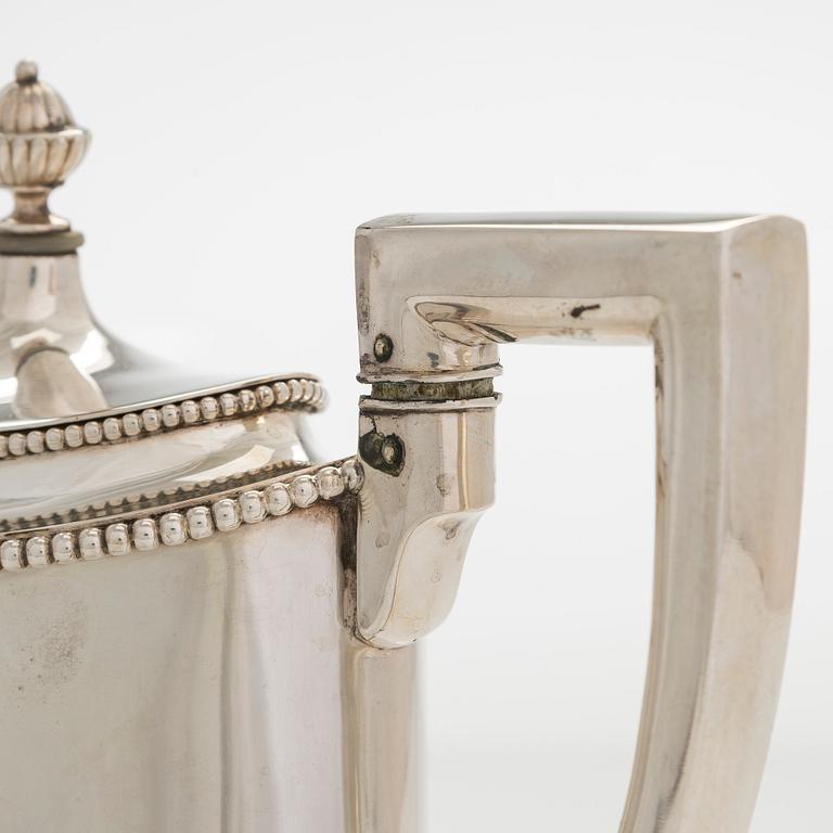 An early 20th century 4- piece sterling silver empire coffee set, C.G. Hallbergs Guldsmeds AB, Stockholm.
