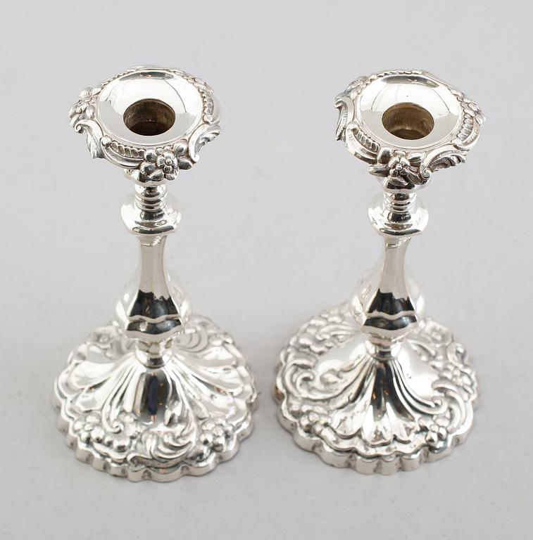 LJUSSTAKAR, ett par, silver, 1861.