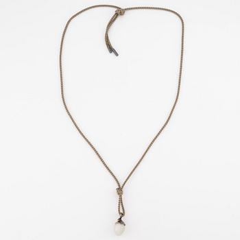 Ole Lynggaard, hänge, "Lotus", guld och silver samt små briljantslipade diamanter och troligen månsten.