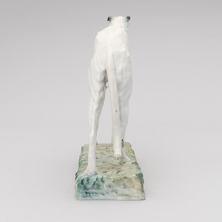 A porcelain borzoi figurine from Arabia Finland, signed and dated -30.