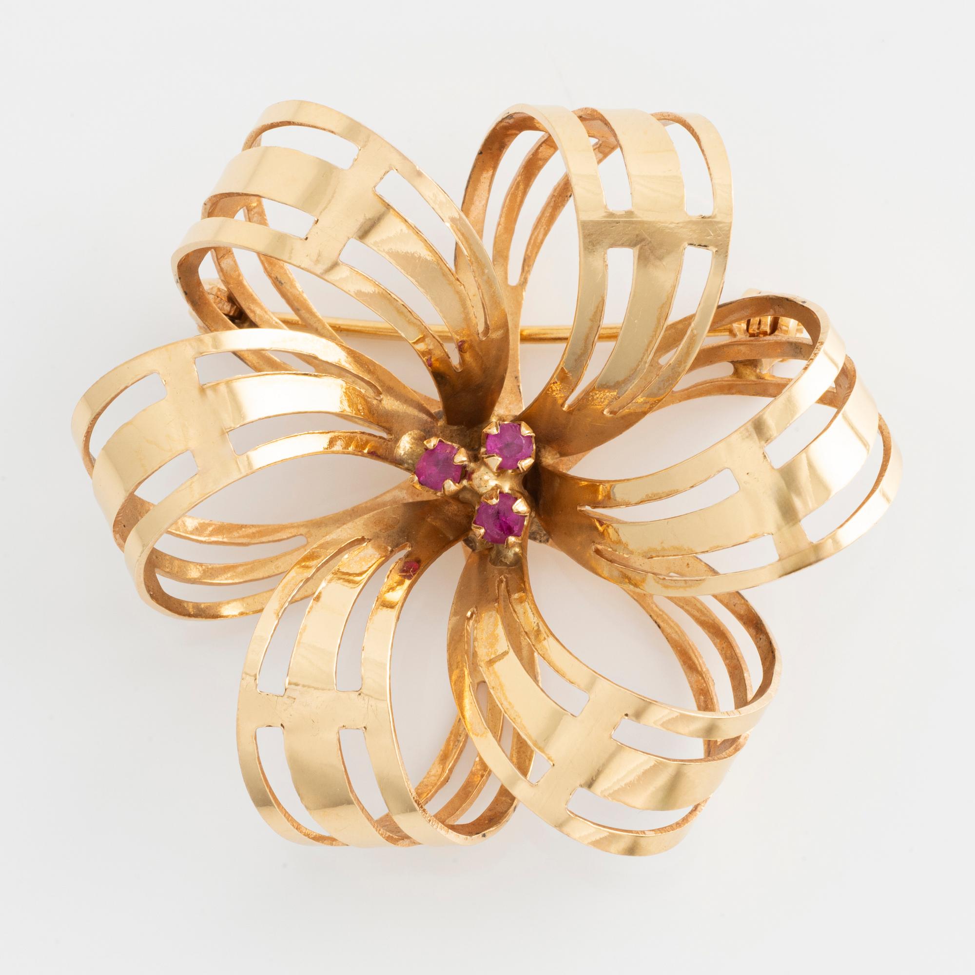 Brosch 18K guld med rosa stenar.