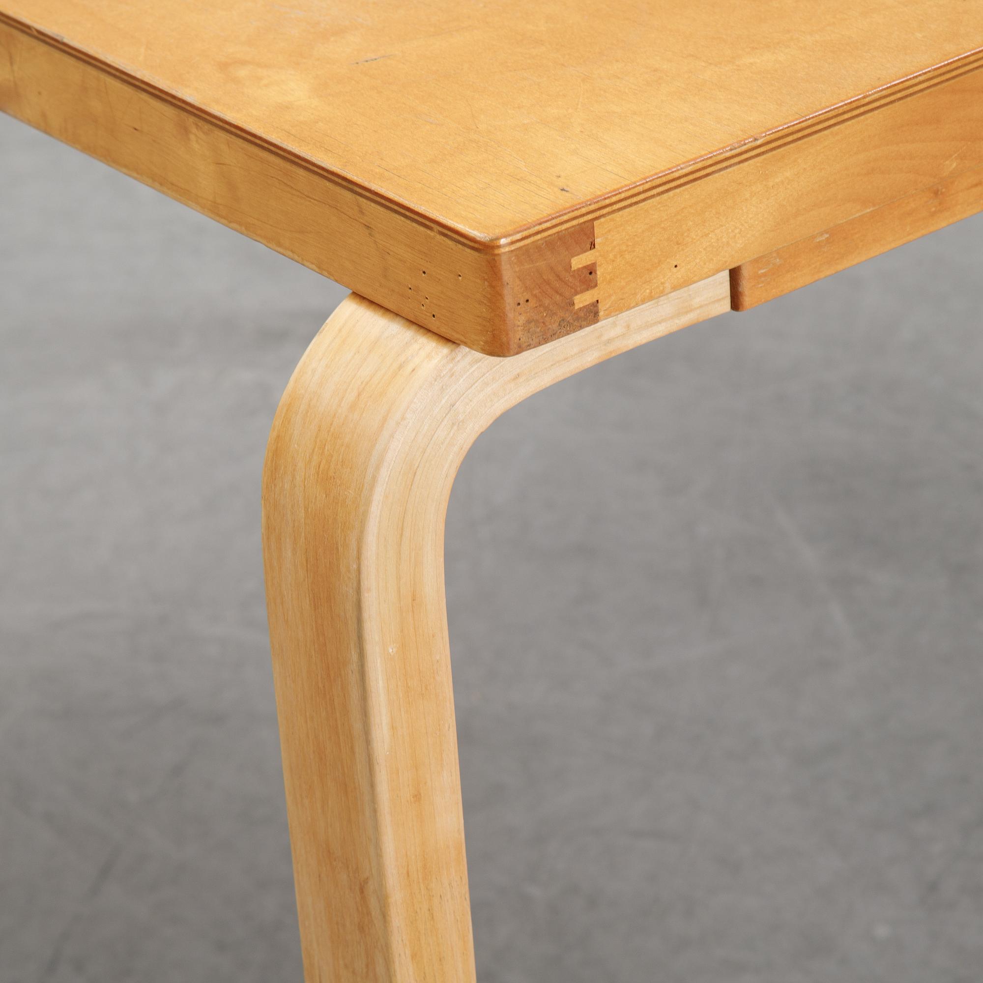 Alvar Aalto, a birch dining table, Artek, Finland, mid 20th Century.