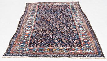 An oriental rug, c. 232 x 125 cm.