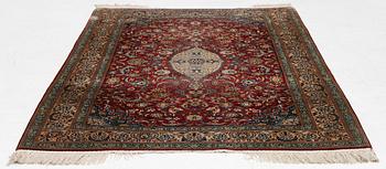 A silk Kashmir rug, c. 176 x 121 cm.
