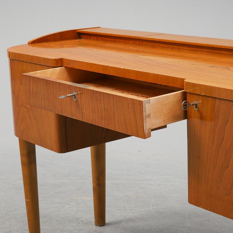 A 1940's table with pouf.